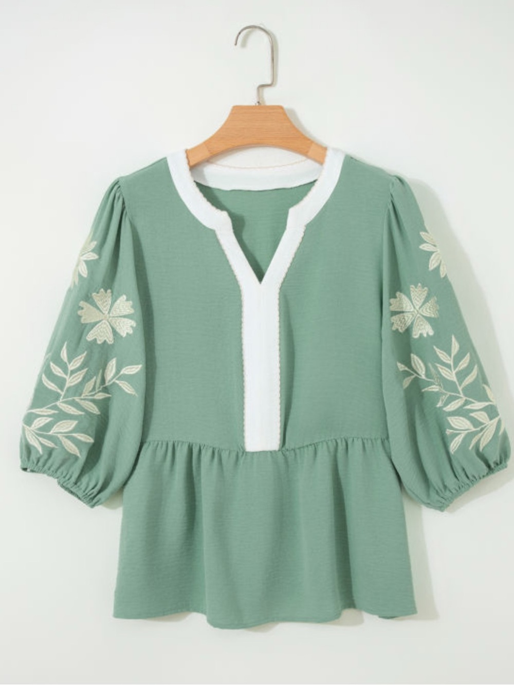 1228.  Green embroidered puff sleeve peplum top